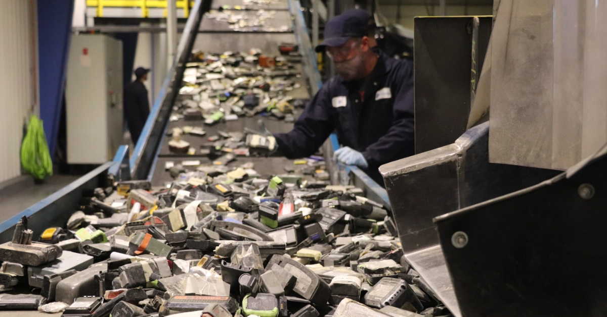 Li-Cycle employee sorting batteries to be shredded